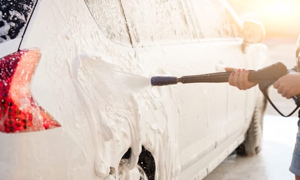 Pressure foam sprayer on car wash