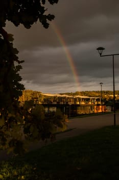 Heavy rain and rainbow above the Vistula river in Krakow Poland. Stunning views of the city rainy season and rainbow