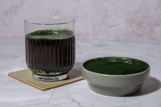 Blue-green algae Chlorella and spirulina powder drink. Super powder. Natural supplement of algae. Detox superfood drink cocktail. Food supplement source of protein and beta carotene