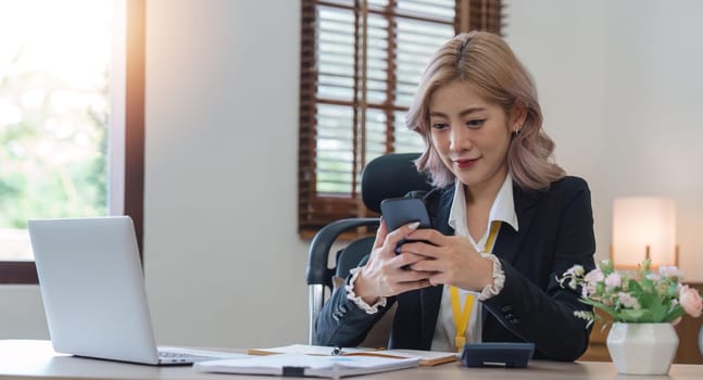 business woman with phone for communication typing while smile happy and relax