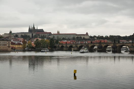 View of the Vltava River and Charles Bridge in the rain in Prague, Czech Republic