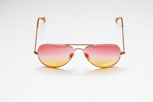 Classic sunglasses with a gradient on a white background.