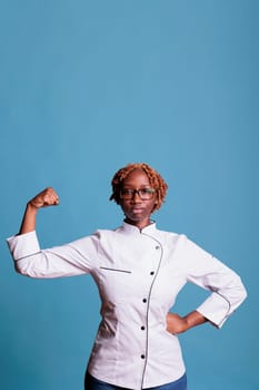 woman wearing a kitchen uniform looking empowered