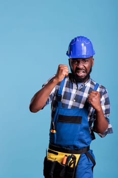 Construction worker gesturing to fight