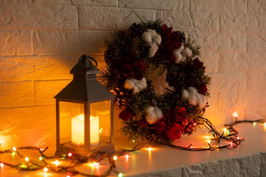 Christmas ring or wreath with glowing garland on background.