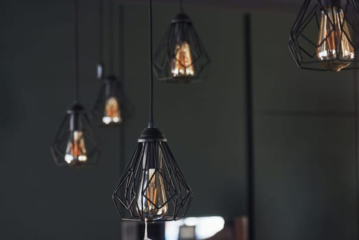 Modern designed light bulbs hangs on the wall indoors. Decoration and domestic life