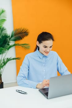 woman with laptop conversation online via internet remote work