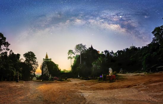 Panorama, the Milky Way above the tree shadow during the Twilight Before sunrise, pagoda on the hilltop