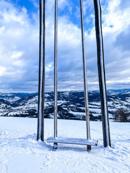 Ski swing snowy mountain winter forest with chair lift At The Ski Resort in winter. Snowy weather Ski holidays Winter sport and outdoor activities Outdoor tourism