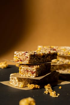 Homemade Granola energy bar. Variety of homemade protein granola breakfast bars, with nuts, raisins dried cherries and chocolate. Healthy nutrition eating Gluten free cereal dieting snack super food