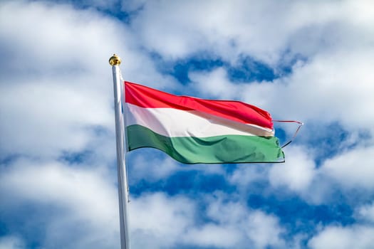 Hungarian flag or flag of Hungary waving in the wind
