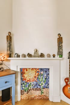a living room with a fireplace with a mosaic tile