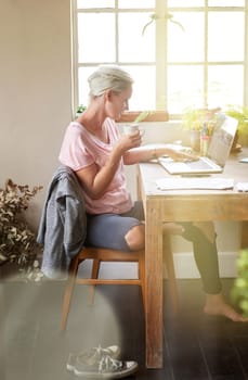 Awaken your creative spirit. a female designer working on her laptop at home.