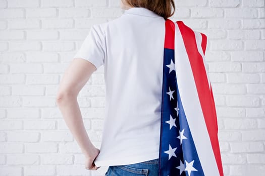White polo shirt on woman over USA flag background, mockup design