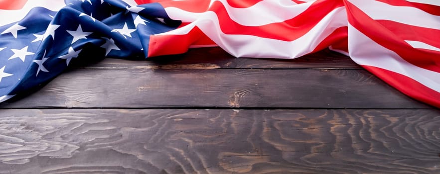 Closeup of American flag on dark wooden background