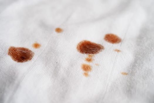 Dirty tomato sauce stain or ketchup on cloth to wash with washing powder, cleaning housework concept.