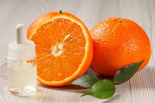Cut orange with two whole oranges and bottle with aromatherapy oil