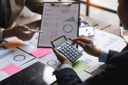 Financial Business meeting analyze tax graph calculator company's performance to create profits and growth, Market research reports and income statistics, Financial and Accounting concept