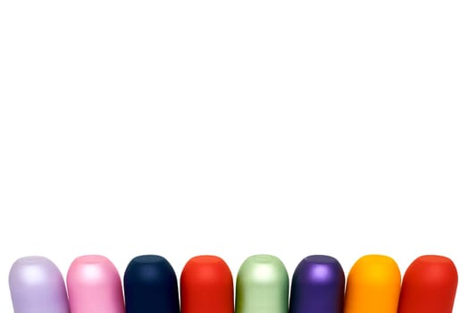 Multicolored bright cones cylinders caps and place for text on white
