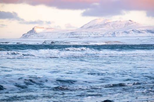 Seascape With Mountains in Winter, Sunset Fluffy Clouds and Stormy Sea, Iceland