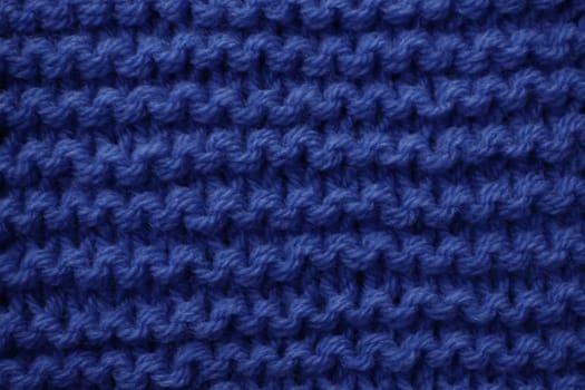 Crochet texture of woolen fabric close-up.