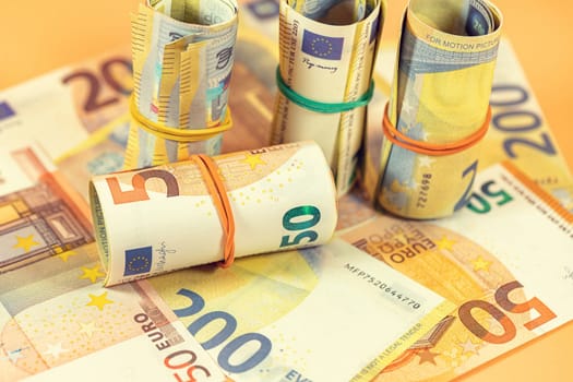 Background of twisted and scattered Euro banknotes