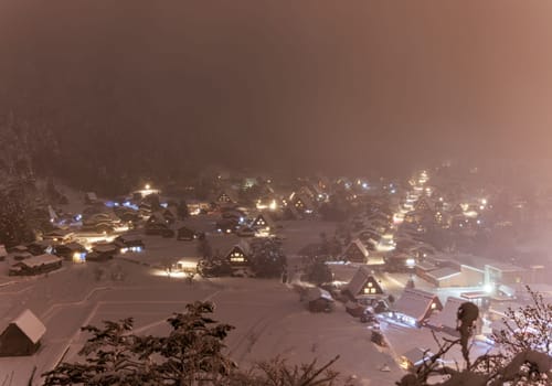 Shirakawa-go Houses Bathed in Pink Snowy Mist on Winter Night