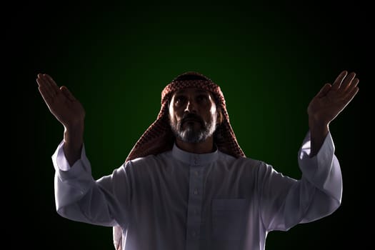 The Muslim raised his hands to the sky. Praising the One God of Allah.