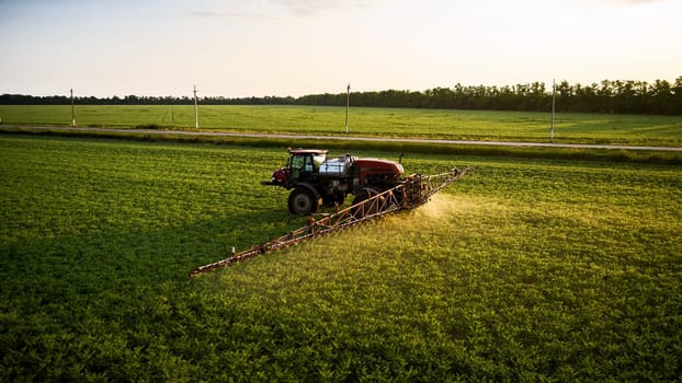 Sprayer CASE 3330 spraying pesticides on chickpea field. Field treatment with chemicals against pests, insects and plant diseases. Taking care of the Crop. 21.06.22, Rostov area. Russi