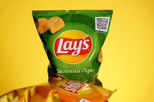 Tyumen, Russia-January 06, 2023: Lays a popular brand of potato chips close up. Lays is one of the most famous brands of chips in the world