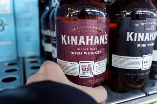 Tyumen, Russia-March 17, 2023: Bottle of Irish Whiskey Kinahans Single. Selective focus