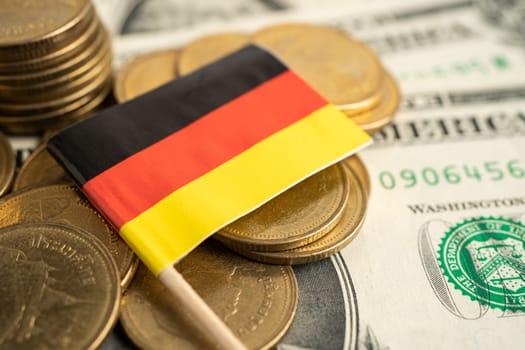 Stack of coins with USA Germany flag on white background.
