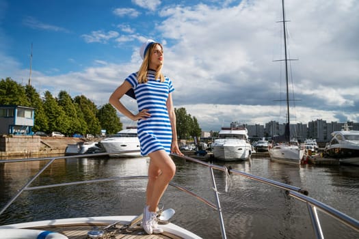 Young woman on a yacht posing on a sunny day