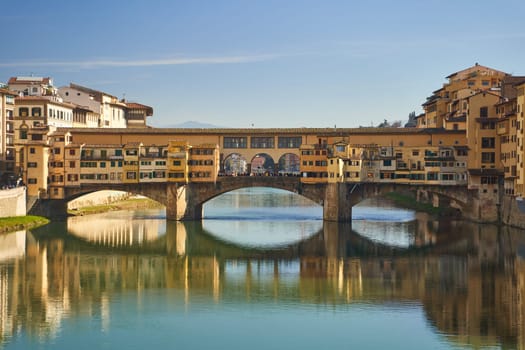 Florence, Italy - 12.02.2023: View of the famous Ponte alle Grazie bridge and the Arno river in Florence