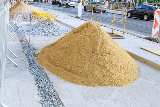 A pile of sand lying on a new pavement for paving and jointing.