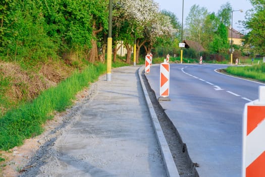 Repair of the road, installation of curbs near the carriageway.