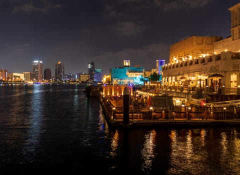 The Creek by Bur Dubai and Al Seef at night with waterfront restaurants