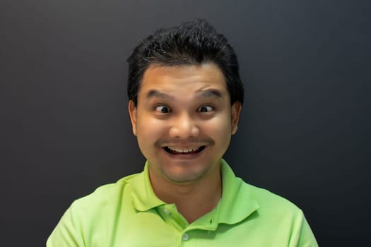 Asian man smile have crazy squintin with confusion
