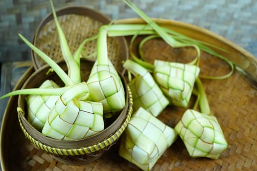 Group of empty ketupat on bamboo tray for Idul Fitri or Eid Mubarak in Indonesia.