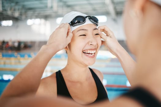 Sports, women or funny friends in swimming pool training, workout and exercise for wellness together. Athlete swimmers, cap or happy Asian girls speaking or bonding in fitness or healthy lifestyle.