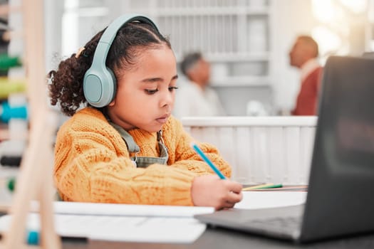 Headphones, elearning and kid writing in home for online class, homeschool and homework. Laptop, education and development of girl studying, distance learning and knowledge, notes and growth in house