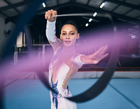 Ribbon, gymnastics and portrait of woman dance for performance, sports competition and action show. Female, rhythmic movement and dancing athlete with creative talent, concert event or practice arena