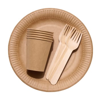 Brown paper cups, wooden fork and plates on a white background. Recyclable garbage, rejection of plastic, top view