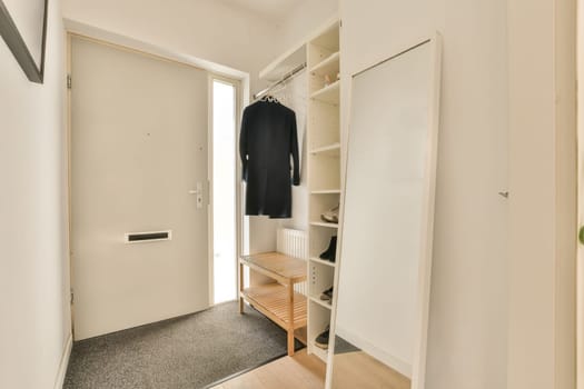 a bedroom with a closet and a wardrobe