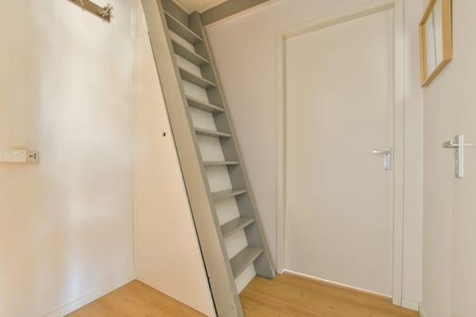 a flight of stairs in a room with a door