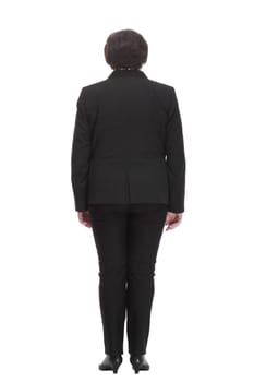 rear view. Mature business woman in a black pantsuit .