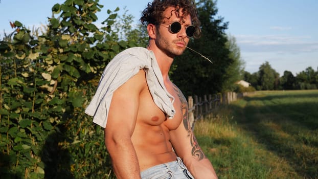 Muscular Shirtless Hunk Man Outdoor in Countryside