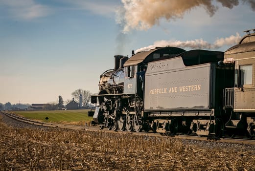 Rear Close Up View of a Classic Steam Locomotive Traveling Thru the Countryside