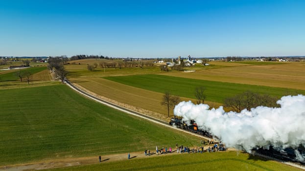 Aerial of a Steam Double-Header Freight , Passenger Combo Train Approaching Blowing Lots of Smoke