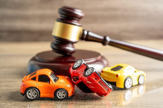 Bangkok, Thailand, January 1, 2023 Hammer gavel judge with car vehicle accident, insurance coverage claim lawsuit court case.